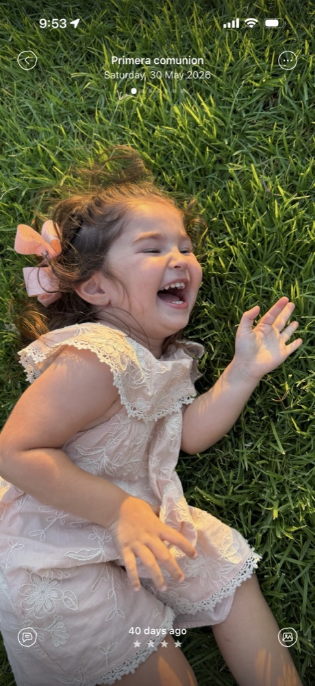 Memory View: a full-screen photo of a toddler laughing on the grass